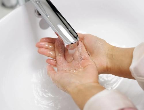 Washing Hands in Basin