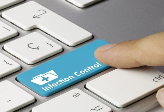 Infection control written on computer keyboard image